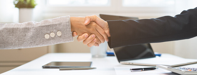 Successful asian young business woman, partnership, teamwork handshake or greeting together at office after project done, good deal. Happy business people, group meeting, colleagues shaking hands, © KMPZZZ