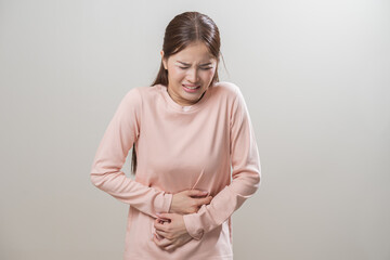 Flatulence asian young woman intolerance hand in stomach ache, suffer from food poisoning,...