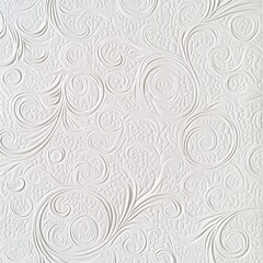 A textured white wall design featuring swirling patterns and intricate details.