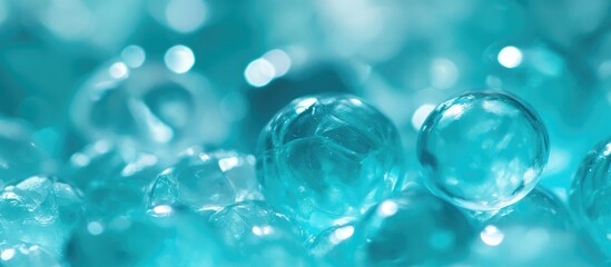 Close-up view of shimmering turquoise aqua gems reflecting light in a visually captivating abstract arrangement.