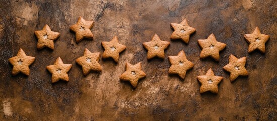 Star shaped gingerbread cookies arranged in rustic style on a wooden background for a festive Santa breakfast celebration