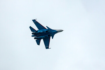 Aerobatics from Russian Knights and Swifts . Russian military aircraft show aerobatics in the blue...
