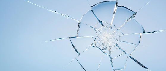 Obraz premium shattered glass against blue background symbolizes impact of terrorism, evoking sense of fragility and destruction. cracks spread outward, creating dramatic visual effect