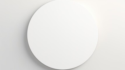 Round white canvas mockup on a minimalistic background for artistic designs and poster frame presentations in a clean aesthetic setting.