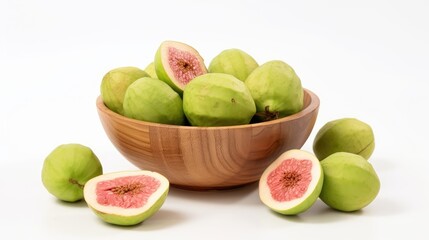 Fresh guava fruits and slices arranged in a wooden bowl on a clean white background showcasing vibrant colors and textures.