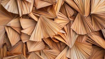 Detailed close-up of intricately arranged dried palm leaves showcasing a unique fan shape and natural earthy tones.