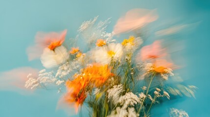 Vibrant bouquet of flowers in motion with a soft-focus effect, set against a serene blue background creating an artistic and dreamy atmosphere.