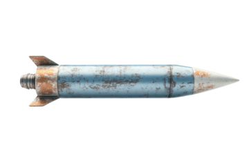 Rusty blue rocket with a metallic finish resting on a flat surface in a well-lit environment