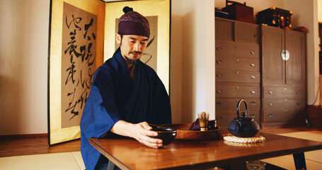 Man, relax and tea ceremony for matcha, culture and tradition in home with preparation in Japan....