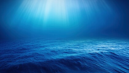 Ocean Depths: Sunbeams pierce the tranquil blue of the ocean floor, casting ethereal light on the undulating seabed. A serene, mysterious backdrop for your creative endeavors. 