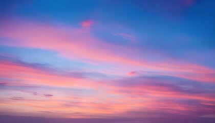 Obraz premium Dreamy Sunset Sky: A breathtaking panorama of the sky at sunset, showcasing a symphony of pink, purple, and blue hues, painting a mesmerizing scene of nature's artistry. 