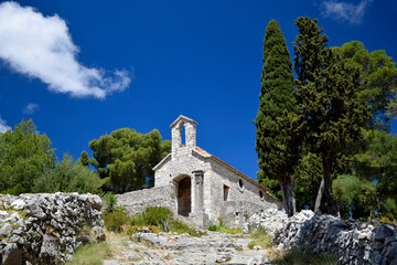 A chapel in the wood near Spanish Fortress, Hvar Island, Croatia. Church of Our Lady of Kruvenica...