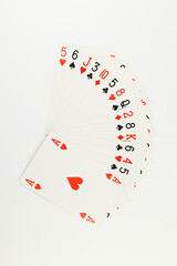 Top view of playing cards on white background. Board game, poker. Copy space, flat lay.