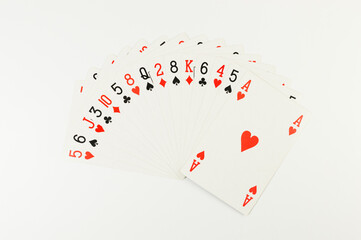 Top view of playing cards on white background. Board game, poker. Copy space, flat lay.