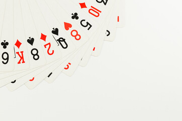 Fototapeta na wymiar Top view of playing cards on white background. Board game, poker. Copy space, flat lay.
