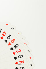 Top view of playing cards on white background. Board game, poker. Copy space, flat lay.