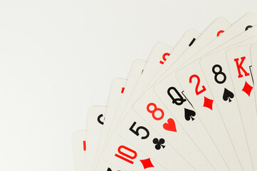 Fototapeta na wymiar Top view of playing cards on white background. Board game, poker. Copy space, flat lay.