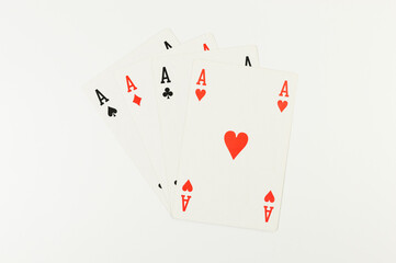 Top view of playing cards on white background. Four aces cards, board game, poker. Copy space, flat lay.