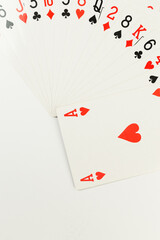 Top view of playing cards on white background. Four aces cards, board game, poker. Copy space, flat lay.