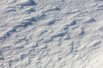 The snow is white and the ground is covered in it