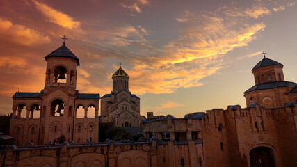 The sunset scene at Holy Trinity Cathedral or Tsminda Sameba Church aerial panoramic view in Tbilisi old town. Tbilisi is the capital and the largest city of Georgia. © SASITHORN
