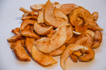 dried apples chips on a light background
