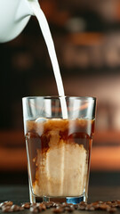 Freeze Motion Shot of Pouring Milk into Coffee in a Cafe