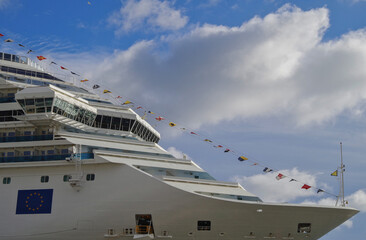 Modern Italian cruiseship cruise ship liner Fascinosa during sunset in port of Savona, Italy during...