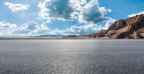 Asphalt road and Yardang landform mountain natural landscape in Xinjiang, China. Outdoor natural...