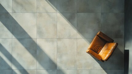 Aerial view of a solitary chair on tiled floor.