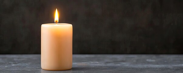A single lit candle with a soft glow, resting on a smooth surface. Perfect for creating a warm and inviting atmosphere in any space.