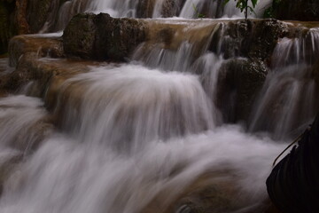 Travel to waterfalls during the rainy season, The tiers of the waterfall contrast beautifully with the sky