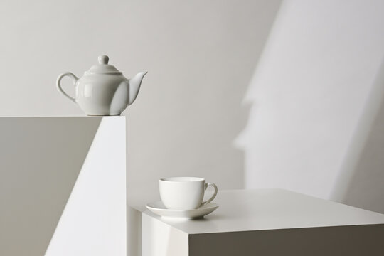 White abstract composition with teapot and cup