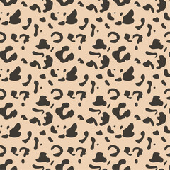 A seamless Jaguar fur pattern vector design. A seamless patterns of leopard on cream background. Wildlife seamless repeat