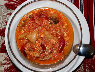 Pepper stew with tomatoes and grated cheese. Traditional romanian food