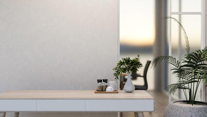A minimalist wooden table features a ceramic vase and a coffee tray in a modern bright room.