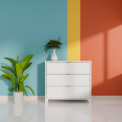 A trendy colorful room features a minimal white drawer, decorative plants, and a white tiled floor.