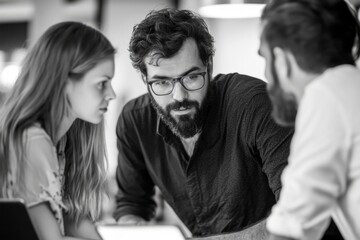 A creative team collaborates intensely. They share ideas and strategies. The atmosphere is focused and productive. This image captures teamwork. Generative AI