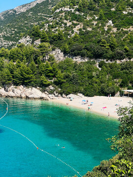 Stunning Mediterranean beach with turquoise water and lush greenery. Beach Veliki Zal, Croatia.