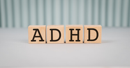 ADHD Abbreviation on ADHD cubes on a light background. Close ADHD - Attention Deficit Hyperactivity Disorder.