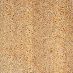 Close up detail of beige rough concrete wall texture. Design element use for background or backdrop in architecture and construction concept