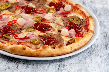 fresh pizza on the white plate