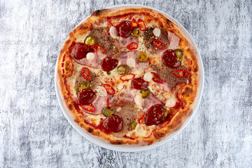 fresh pizza on the white plate