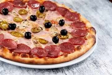 fresh pizza on the white plate