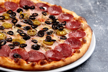 fresh pizza on the white plate