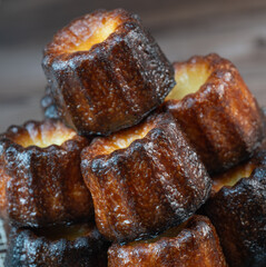Caneles de bordeaux, traditional French sweet dessert with white table background, High quality photo