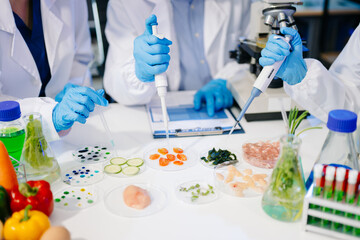 Dynamic scene of food scientists using microscopes and pipettes in a lab,