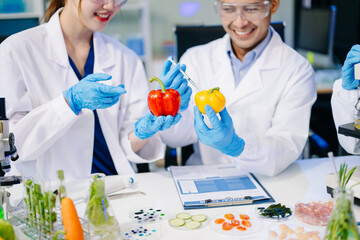 Dynamic scene of food scientists using microscopes and pipettes in a lab,