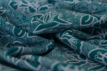 A piece of fabric with a floral pattern
