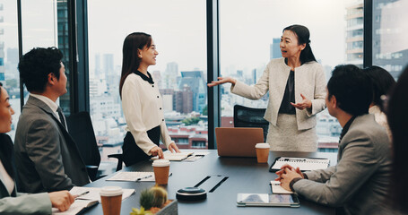 Business people, meeting and teamwork in office for praise, celebration and company financial review. Japan, stakeholder and executive conference for investment proposal, collaboration or achievement